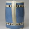 Pearlware pottery mug with light blue slip decoration and inlaid brown checker, circa 1800