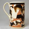 Mochaware mug decorated with slip on a creamware body, circa 1820