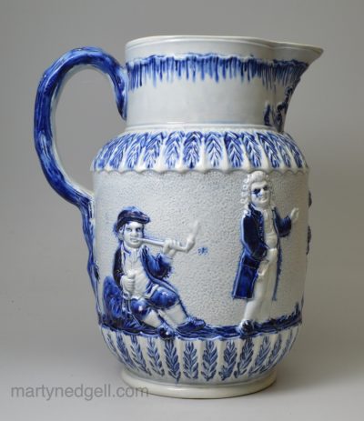Pearlware pottery serving jug moulded with the Parson, Clerk and Sexton, circa 1800