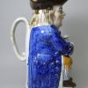 Prattware pottery Toby jug decorated with enamels under a pearlware glaze, circa 1820