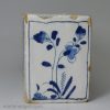 London delft flower brick painted in blue with a Chinese style figure, circa 1750