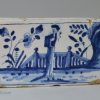 London delft flower brick painted in blue with a Chinese style figure, circa 1750