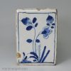 London delft flower brick painted in blue with a Chinese style figure, circa 1750