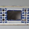 London delft flower brick painted in blue with a Chinese style figure, circa 1750