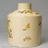 Creamware pottery tea canister painted with yellow flowers over the glaze, circa 1780