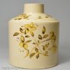 Creamware pottery tea canister painted with yellow flowers over the glaze, circa 1780