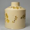 Creamware pottery tea canister painted with yellow flowers over the glaze, circa 1780