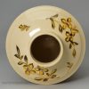 Creamware pottery tea canister painted with yellow flowers over the glaze, circa 1780