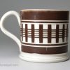 Small mochaware mug, engine turned slip on a pearlware base, circa 1840