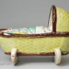 Pearlware pottery toy cradle with young girl, circa 1820