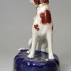 Staffordshire porcelain figure of a chained hound, circa 1840