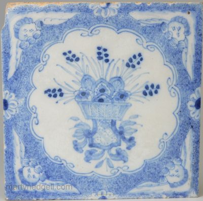Liverpool Delft tile painted in blue with angel head corners, circa 1760