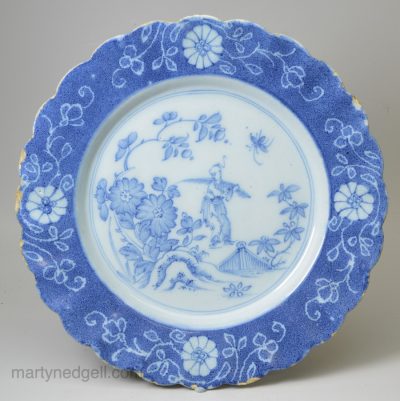 Liverpool delft plate decorated with a chinaman in blue and a powder blue border, circa 1750