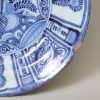 Dutch Delft charger painted in a Kraak style in blue, circa 1700