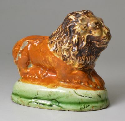 Small prattware pottery lion, circa 1800