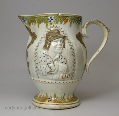 Prattware pottery jug moulded with the Miser and Spendthrift, circa 1820