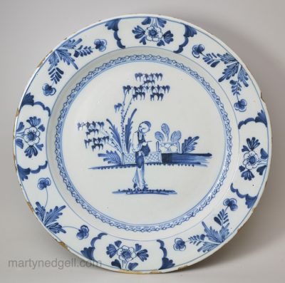 London delft charger painted with a Chines man in blue, circa 1750