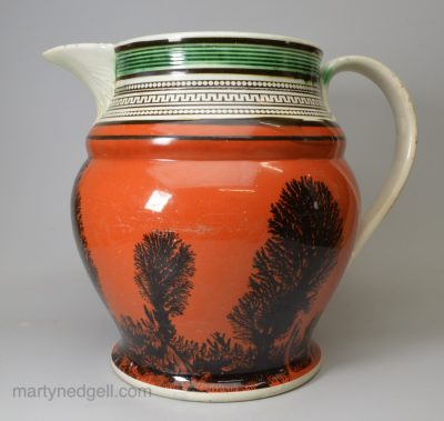 Oversized mocha jug decorated with slip inlay and dendritic patterns, circa 1820