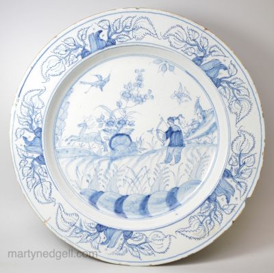 Liverpool delft charger painted in blue with a Chinese archer, circa 1750