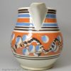 Mochaware snail trail and cat's eye decorated jug with a make do handle, circa 1820