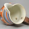 Mochaware snail trail and cat's eye decorated jug with a make do handle, circa 1820