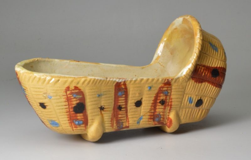 Tan coloured pottery toy cradle, circa 1820