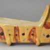 Tan coloured pottery toy cradle, circa 1820