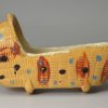 Tan coloured pottery toy cradle, circa 1820