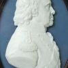 A portrait of Admiral Howe moulded in glass by James Tassie and dated 1798