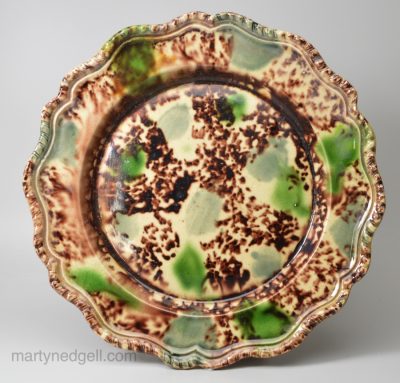 Creamware plate decorated with Whieldon type colouring under the glaze, circa 1770