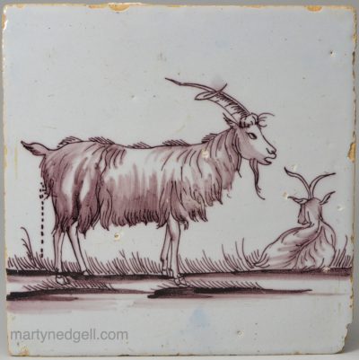 Liverpool delft tile decorated in manganese with a goat defecating, circa 1750