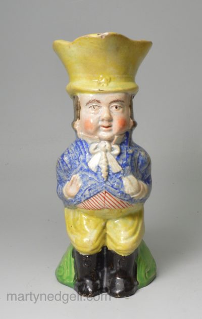 Staffordshire pearlware pottery jug moulded as Paul Pry, circa 1820