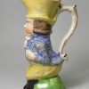 Staffordshire pearlware pottery jug moulded as Paul Pry, circa 1820