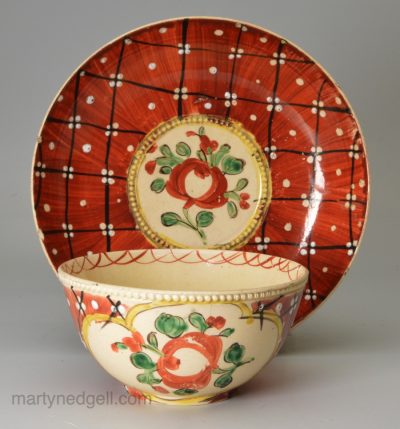 English creamware pottery 'Chintz' tea bowl and saucer, circa 1770