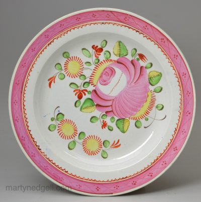 Pearlware pottery plate decorated with over glaze enamels, circa 1820