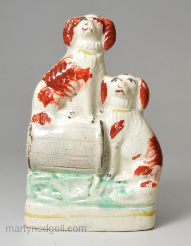 Staffordshire pottery spaniels on a barrel, circa 1870