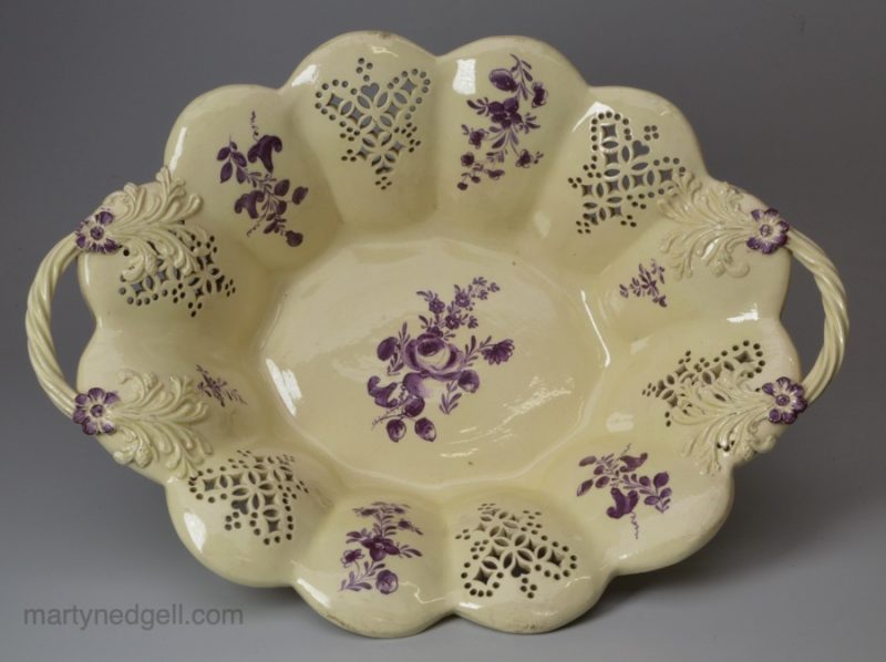 Creamware pottery basket decorated with purple floral sprays, circa 1770