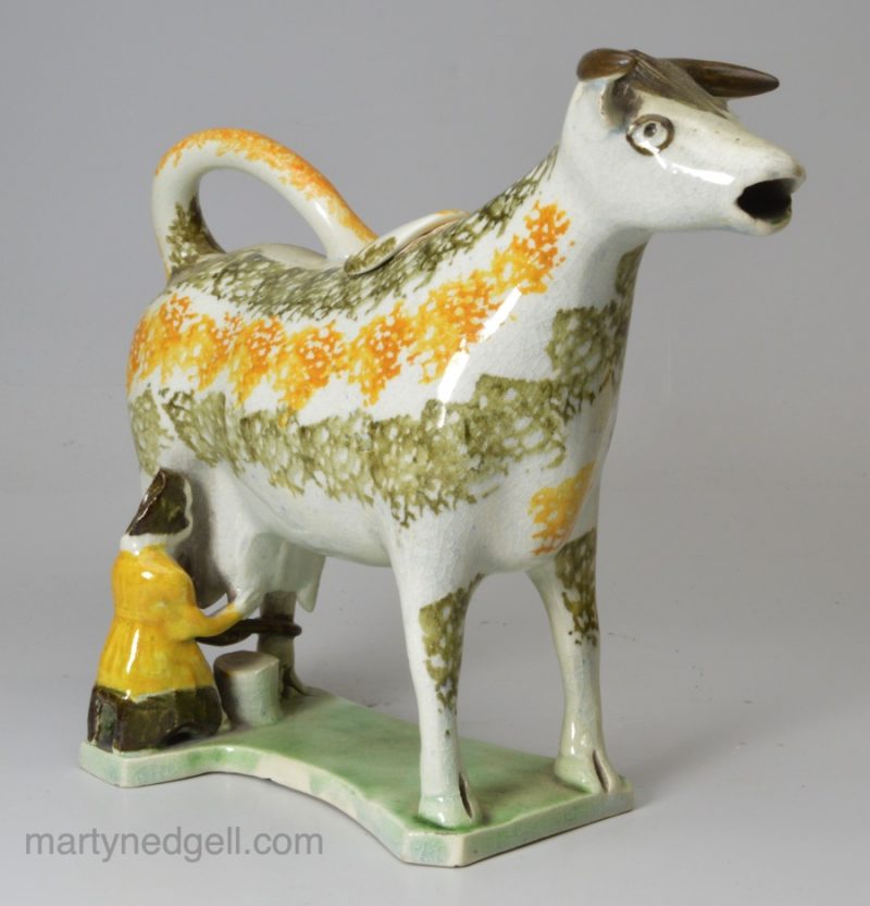 Prattware pottery cow creamer with hobbled legs, circa 1820