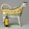 Prattware pottery cow creamer with hobbled legs, circa 1820