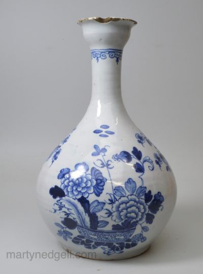 Dublin or Liverpool delft bottle painted in blue with the war bonnet pattern, circa 1750