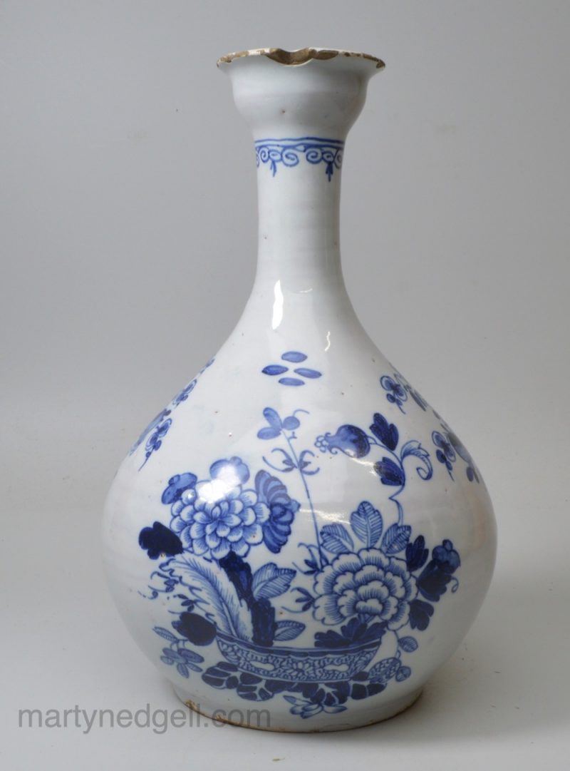 Dublin or Liverpool delft bottle painted in blue with the war bonnet pattern, circa 1750