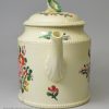 Creamware pottery teapot decorated with flowers over the glaze, circa 1780, probably Leeds Pottery