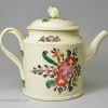 Creamware pottery teapot decorated with flowers over the glaze, circa 1780, probably Leeds Pottery