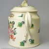 Creamware pottery teapot decorated with flowers over the glaze, circa 1780, probably Leeds Pottery