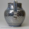 Blue coloured pottery jug decorated with silver resist lustre, circa 1820