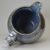 Blue coloured pottery jug decorated with silver resist lustre, circa 1820