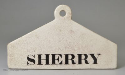Glazed white terracotta bin label 'SHERRY', circa 1850