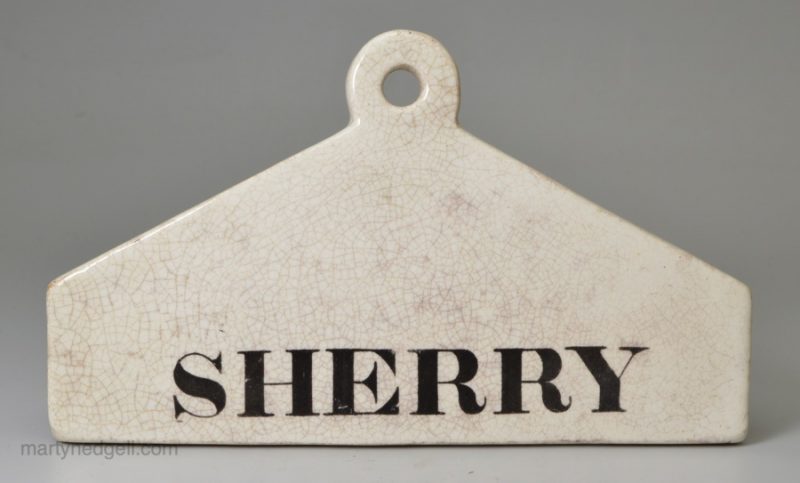 Glazed white terracotta bin label 'SHERRY', circa 1850