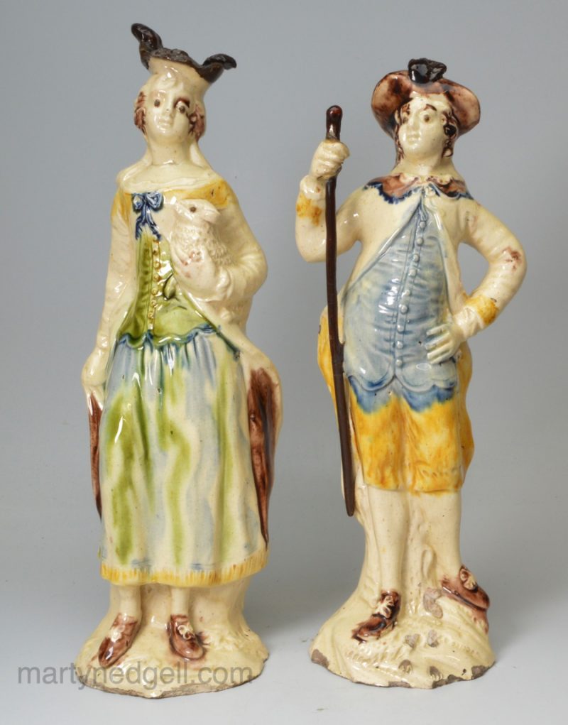 Pair of large early creamware pottery models of a shepherd and shepherdess, circa 1750