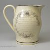 Creamware pottery commemorative jug, Queen Caroline and the green bag, circa 1821